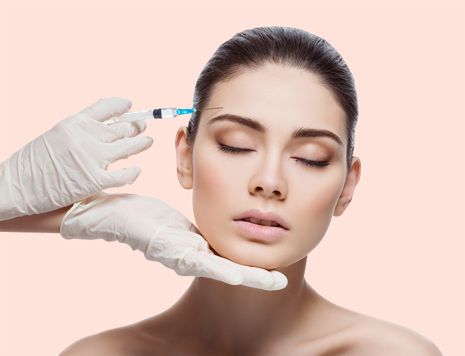 Stock image of a girl undergoing botulinum toxin injection on forehead