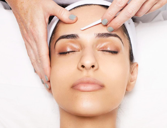 Stock image of girl undergoing dermaplaning treatment