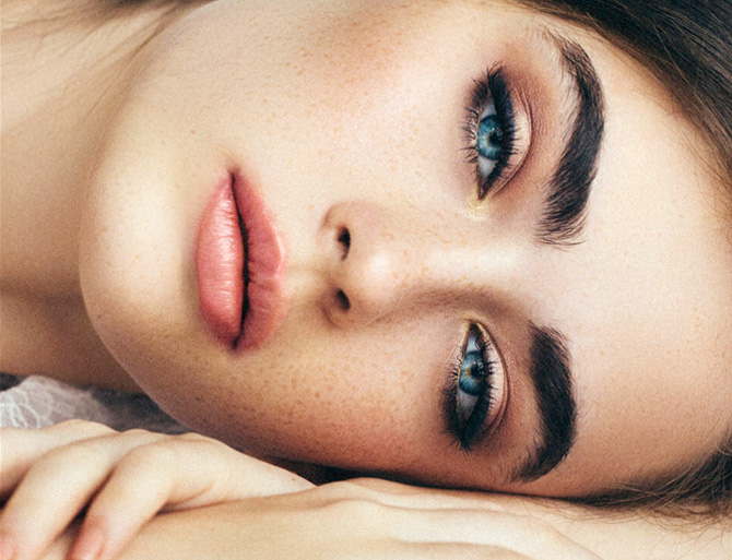 Stock image of a girl laying face on her hands