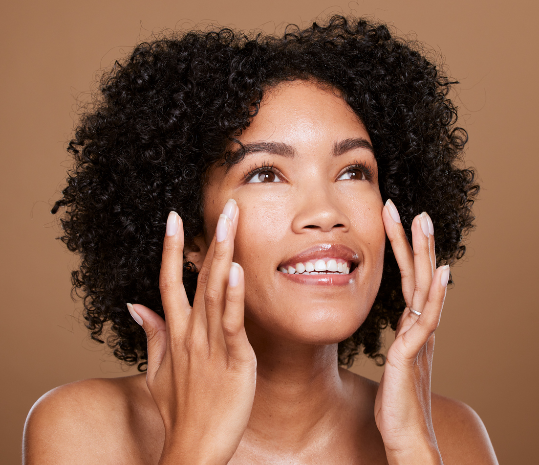 Black woman with glowing skin as the featured image for "How Does a Medical Spa Differ from a Day Spa?"